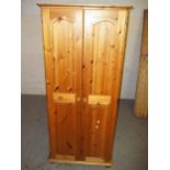 A SOLID PINE DOUBLE TWO DOOR WARDROBE