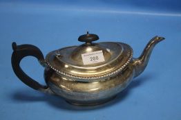 A HALLMARKED SILVER TEAPOT WITH EBONY HANDLE AND FINIAL