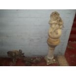 FOUR CONCRETE GARDEN ITEMS TO INCLUDE A CONCRETE CHERUB ON A BALL STATUE, A TALL PLINTH ETC.