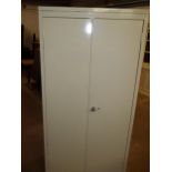 A STRONG STEEL TWO DOOR SHELVED STORAGE CABINET