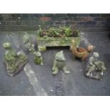 SEVEN ITEMS TO INCLUDE SIX CONCRETE GARDEN STATUES AND A CONCRETE PLANTER WITH PLINTHS