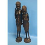 A PAIR OF WOODEN CARVED TRIBAL FIGURESCondition Report:Both missing what should be in their hands