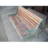 A CAST IRON AND WOOD GARDEN BENCH