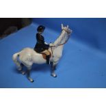 A BESWICK HUNTSWOMAN ON GREY HORSE