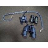 A SET OF CASED VISTA 10 X 50 BINOCULARS, LEATHER CASED PAIR OF SMALL BINOCULARS, A VINTAGE TOOL IN