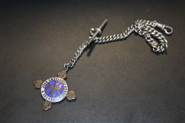 A SILVER POCKET WATCH CHAIN WITH ST JOHNS AMBULANCE FOB