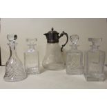 FOUR ASSORTED GLASS DECANTERS TO INCLUDE A GOLF THEMED EXAMPLE TOGETHER WITH A SILVER PLATE TOPPED