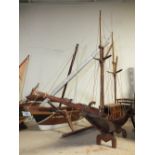 FOUR ASSORTED LARGE MODEL WOODEN BOATS