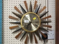 A RETRO TEAK AND METAL PAICO SUNBURST WALL CLOCK - W 39 CM