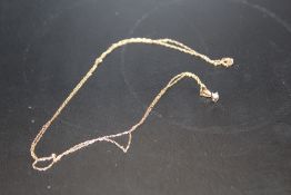 A 9CT GOLD DIAMOND SET NECKLACE