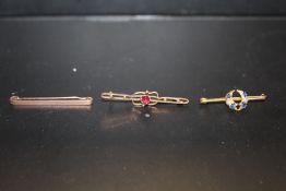 TWO 9 CT GOLD BAR BROOCHES, TOGETHER WITH ANOTHER SET WITH BLUE STONES AND SEED PEARLS (3)