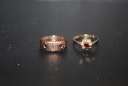 A HALLMARKED 9 CARAT GOLD AND GARNET DRESS RING, TOGETHER WITH A 9 CARAT ROSE GOLD EXAMPLE - MISSING