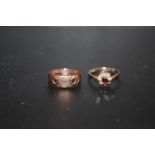 A HALLMARKED 9 CARAT GOLD AND GARNET DRESS RING, TOGETHER WITH A 9 CARAT ROSE GOLD EXAMPLE - MISSING