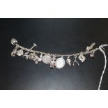 A VINTAGE SILVER CHARM BRACELET