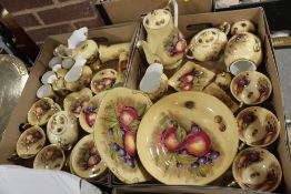 TWO TRAYS OF AYNSLEY ORCHARD GOLD CHINA TO INCLUDE CUPS AND SAUCERS WITH FRUIT PATTERN INTERIORS ,