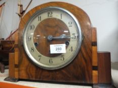 AN ART DECO WALNUT MANTLE CLOCK