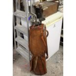 A VINTAGE GOLF BAG A/F TOGETHER WITH CLUBS TO INCLUDE SPALDING EXAMPLES