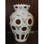 A HAND PAINTED FLORAL PINK GLASS VASE WITH WHITE GLASS OVERLAY