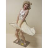 A CERAMIC FIGURE OF MARILYN MONROE ON STAND H- 42CM