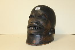 A LARGE EAST AFRICAN TRIBAL ART MAKONDE TANZANIA HELMET - H 27 CM