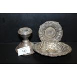 TWO CONTINENTAL STYLE WHITE METAL DISHES, TOGETHER WITH A HALLMARKED SILVER FILLED CANDLESTICK (3)