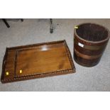 A COPPER BANDED OAK BUCKET, TOGETHER WITH TWO OAK SERVING TRAYS (3)