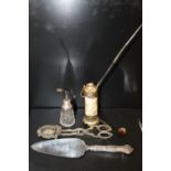 AN ORIENTAL OPIUM PIPE, A POLISHED STONE PENDANT A SILVER TOPPED ATOMISER, TOGETHER WITH A CAKE