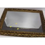 A GILT FRAMED WALL MIRROR OVERALL SIZE - 83CM X 60CM