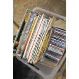 A BOX OF LP RECORDS AND CDS