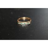 A HALLMARKED 18 CARAT GOLD CHANNEL SET EMERALD AND DIAMOND RING SIZE - N APPROX WEIGHT 2G