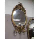 AN ANTIQUE GILT OVAL PIER MIRROR WITH TRIPLE CANDLE SCONCE H-97 CM