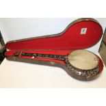 AN ANTIQUE MAHOGANY 'THE MONARCH' BANJO BY WINDSOR OF BIRMIGHAM WITH MOTHER OF PEARL INLAY TO