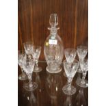 A STUART CRYSTAL FERN PATTERN DECANTER AND FOUR DRINKING GLASSES