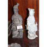 A BLANC DE CHINE STYLE FIGURE OF A GEISHA TOGETHER WITH A CERAMIC WARRIOR FIGURE