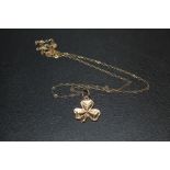A HALLMARKED 9 CARAT GOLD SHAMROCK PENDANT ON 9CT GOLD CHAIN APPROX WEIGHT 1.2G
