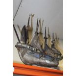 A VINTAGE WOODEN MODEL GALLEON WITH LEATHER SAILS HEIGHT - 64CM