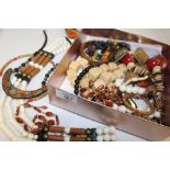 A BOX OF MOSTLY WOODEN COSTUME JEWELLERY ETC.