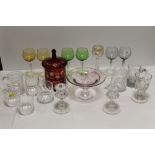 A COLLECTION OF ASSORTED GLASSWARE TO INCLUDE WATERFORD CRYSTAL TUMBLERS, CUT GLASS CANDLESTICKS,