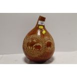 AN AFRICAN STYLE CARVED GOURD WATER BOTTLE DECORATED WITH RHINOS AND ELEPHANTS H- 28CM