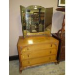 A VINTAGE OAK DRESSING TABLE WITH TRIPLE MIRROR