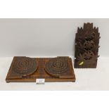 A HEAVILY CARVED MAHOGANY BOOK SLIDE, TOGETHER WITH A FLORALLY CARVED WOODEN WALL HANGING LETTER