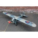 A LARGE REMOTE CONTROLLED MODEL OF AN AEROPLANE WITH REMOTE CONTROL AND INSTRUCTION