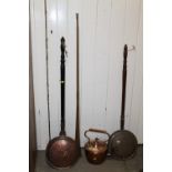 A VINTAGE COPPER KETTLE, COPPER HORN AND TWO COPPER WARMING PANS (4)