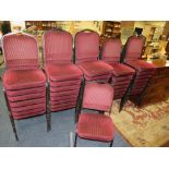 THIRTY NINE TUBULAR FRAMED STACKABLE CHAIRS WITH PADDED SEATS AND BACKRESTS