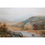 A GILT FRAMED AND GLAZED WATERCOLOUR OF A MOUNTAINOUS RIVER LANDSCAPE SIGNED JOHN W HEPPLE 1914