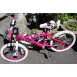 A PINK HUFFY ROCKSTAR CHILDS BICYCLE