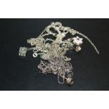 A BAG OF SILVER AND WHITE METAL NECKLACES