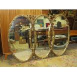 A LARGE MODERN GILT OVAL TRIPLE WALL MIRROR- H 110 CM, W 161 CM