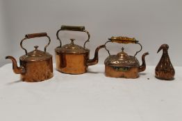THREE VINTAGE COPPER KETTLES, TOGETHER WITH A 'BIRD FUNNEL'