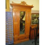 AN EDWARDIAN MIRRORED CARVED SINGLE WARDROBE